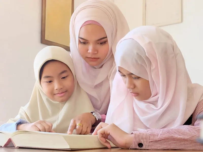 Boy reading Quran